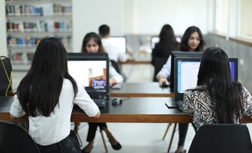 Students working in the library computer lab